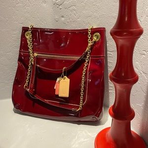Cherry red Patent Leather Coach Bag with chain straps.